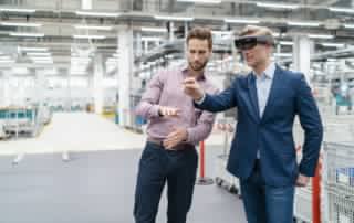 two businessmen with ar glasses in a modern factor 2023 11 27 05 34 05 utc